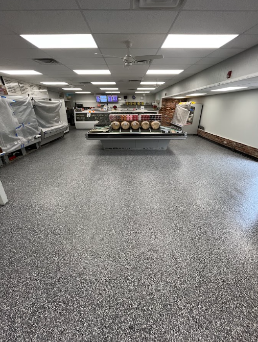 Gray flake epoxy floor coating in a deli and market retail space