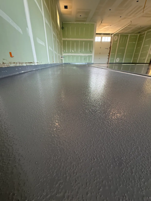 Solid gray resinous floor on a new-build industrial slab