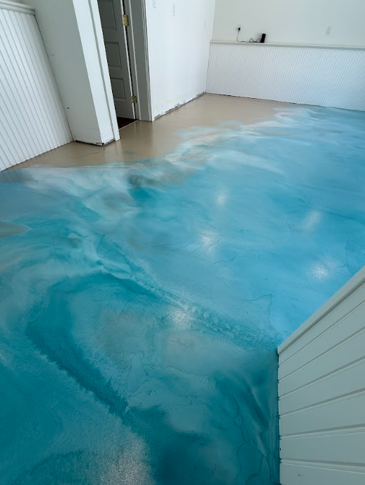 Blue metallic epoxy floor in a residential room
