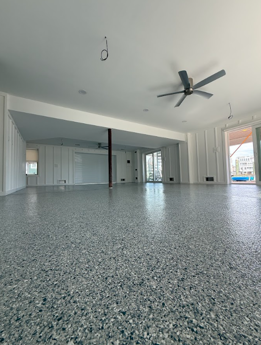 Gray decorative flake floor in an open-concept living space