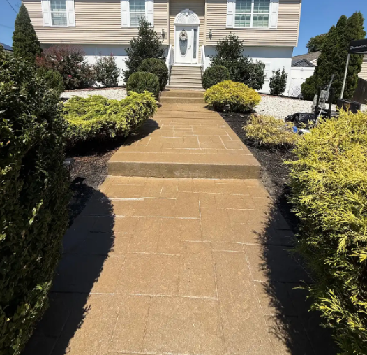 Same paver walkway with a rich, warm, freshly stained and sealed finish